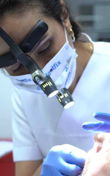 Dr. Ayşe Atay performing precision dental work
